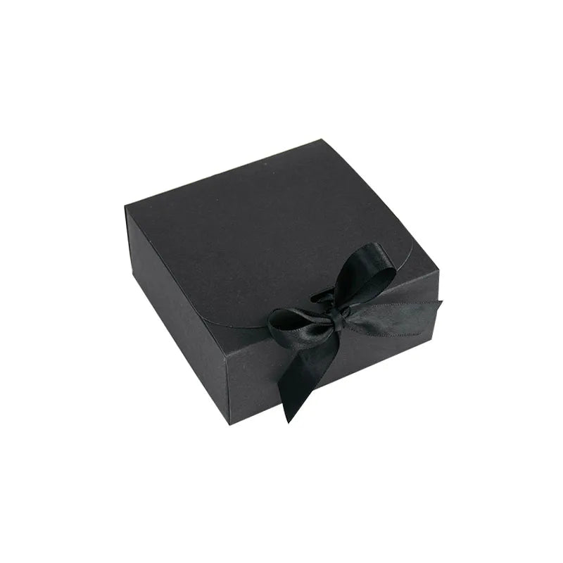 Small Black gift box with a ribbon on a white background