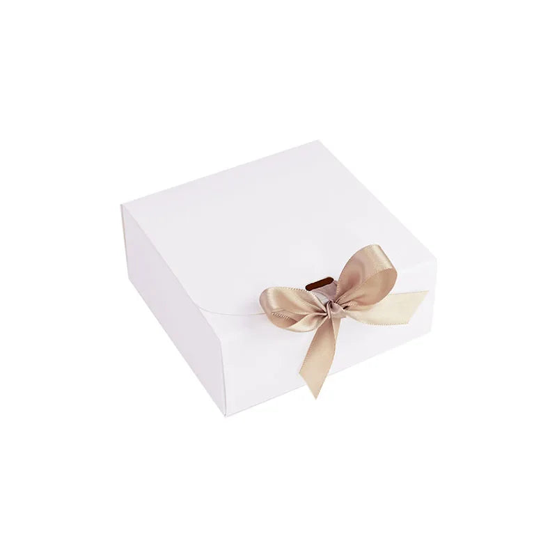 Small White gift box with a ribbon on a white background