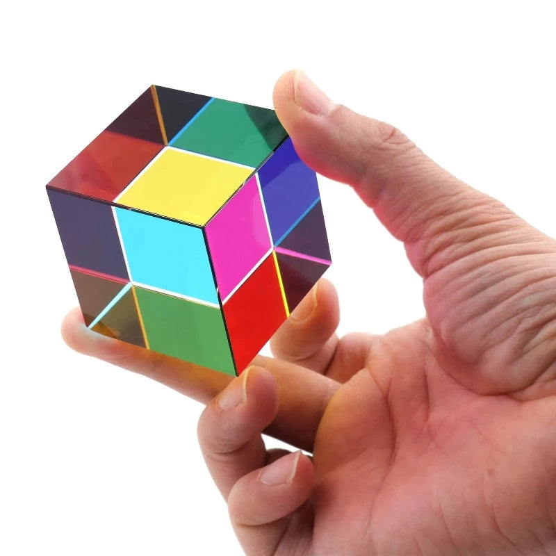 Image from thesciencehut.com: A hand holding a CMY prism cube